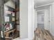 Hallway with wood-look floors leading to bedroom at 810 Catalina Dr, Sanford, FL 32771