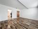 Inviting living area with stylish wood-look floors and neutral white walls at 810 Catalina Dr, Sanford, FL 32771
