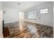 Bright living room with hardwood flooring, fireplace and a large window at 810 Catalina Dr, Sanford, FL 32771