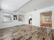 Bright living room with wood-look floors, white walls, and windows for natural light at 810 Catalina Dr, Sanford, FL 32771