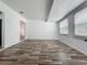 Spacious living room with hardwood flooring, white ceilings and two large windows at 810 Catalina Dr, Sanford, FL 32771