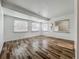 Light-filled living space features wood-look flooring and ample windows at 810 Catalina Dr, Sanford, FL 32771