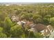 Overhead aerial view of multiple homes featuring backyard pools, lush landscaping, and mature trees at 8800 Torey Pines Ter, Orlando, FL 32819