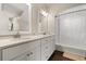 Bright bathroom with double sinks, tub and shower combination, white cabinets, and tile flooring at 8800 Torey Pines Ter, Orlando, FL 32819