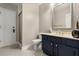 Bathroom features a modern vanity, tile flooring, and a glass-enclosed shower at 8800 Torey Pines Ter, Orlando, FL 32819