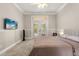 Bedroom includes a ceiling fan, wainscoting and French doors providing lots of light at 8800 Torey Pines Ter, Orlando, FL 32819