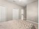 Bedroom showcasing carpet and two closets at 8800 Torey Pines Ter, Orlando, FL 32819
