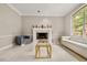 Elegant living room with a stylish fireplace and comfortable seating creates a warm and inviting atmosphere at 8800 Torey Pines Ter, Orlando, FL 32819