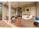 Charming brick patio with comfortable seating, ceiling fan, and convenient outdoor countertop space at 8800 Torey Pines Ter, Orlando, FL 32819