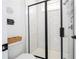 Modern bathroom featuring sleek glass enclosed shower with subway tile, and a new toilet at 9224 Legado Dr, Windermere, FL 34786