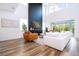 Airy living room featuring high ceilings, large windows, modern fireplace, and stylish decor at 9224 Legado Dr, Windermere, FL 34786