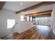 Upstairs loft offers flexible living space with wood beam ceilings and views to the living room below at 9224 Legado Dr, Windermere, FL 34786