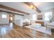 Upstairs loft offers flexible living space with wood beam ceilings and light, neutral decor at 9224 Legado Dr, Windermere, FL 34786
