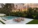 Inviting pool with lounge chairs and nature view in the background at 9224 Legado Dr, Windermere, FL 34786