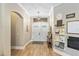 Welcoming entryway featuring tile floors, double doors, and decorative shelving at 9880 Montclair Cir, Apopka, FL 32703