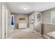 Bright upstairs hallway features neutral walls, carpet, white accents, and decor at 9880 Montclair Cir, Apopka, FL 32703