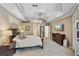 Serene main bedroom with neutral tones, tray ceiling, and abundant natural light at 9880 Montclair Cir, Apopka, FL 32703
