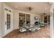 Covered patio with brick flooring, ceiling fans, and outdoor dining area at 9880 Montclair Cir, Apopka, FL 32703