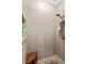 Modern walk-in shower with stylish tile work, built-in niche, and rainfall showerhead at 9880 Montclair Cir, Apopka, FL 32703