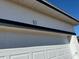 Garage door close-up with house number ten above at 10 Juniper Loop Ter, Ocala, FL 34480