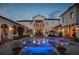 Beautiful backyard at twilight showcasing a pool, manicured landscaping, and architectural lighting at 10138 Enchanted Oak Dr, Golden Oak, FL 32836