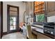 Well-appointed home office with custom cabinetry, a built-in desk, and a view of the outdoors at 10138 Enchanted Oak Dr, Golden Oak, FL 32836