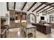 Spacious open kitchen with a large island, custom cabinets, and modern appliances at 10138 Enchanted Oak Dr, Golden Oak, FL 32836