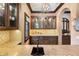 Charming kitchen with custom cabinetry, a copper sink, and stylish backsplash at 10138 Enchanted Oak Dr, Golden Oak, FL 32836