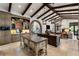 Open kitchen with a large island, custom cabinets, and modern appliances. Seamless flow to living area at 10138 Enchanted Oak Dr, Golden Oak, FL 32836