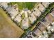Bird's-eye view of a home featuring a pool, manicured backyard, and circular driveway at 10662 Woodchase Cir, Orlando, FL 32836