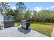 Outdoor space featuring a grill, counter space and brick fence at 10662 Woodchase Cir, Orlando, FL 32836