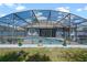 Cozy outdoor living with a screened-in pool at 10662 Woodchase Cir, Orlando, FL 32836