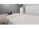 Simply designed bedroom with an adjacent closet and white trim at 10662 Woodchase Cir, Orlando, FL 32836