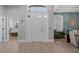 Bright foyer featuring beautiful flooring, an elegant front door, and views into other rooms at 10662 Woodchase Cir, Orlando, FL 32836