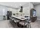 Spacious kitchen with large island, breakfast bar, stainless steel appliances, and white cabinets at 10662 Woodchase Cir, Orlando, FL 32836