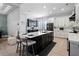 Bright kitchen boasts a large island, breakfast bar, sleek appliances, and ample storage at 10662 Woodchase Cir, Orlando, FL 32836