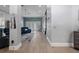 Open-concept living room with stylish flooring, soothing paint, and easy access to outdoor space at 10662 Woodchase Cir, Orlando, FL 32836