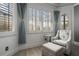 Relaxing sitting area with comfortable seating, shuttered windows, and natural light at 10662 Woodchase Cir, Orlando, FL 32836
