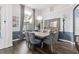 Chic dining area with modern lighting, a grand window view and stylish decor at 1125 E Tuskawilla Pt, Winter Springs, FL 32708