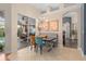 Modern dining room features stylish lighting and gray banquette seating, perfect for entertaining and Gathering meals at 1125 E Tuskawilla Pt, Winter Springs, FL 32708