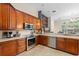 Spacious kitchen featuring stainless steel appliances and stone countertops at 1125 E Tuskawilla Pt, Winter Springs, FL 32708