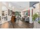 Open-concept living room with bar, comfortable seating, and access to the outdoor patio at 1125 E Tuskawilla Pt, Winter Springs, FL 32708