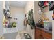 Practical mud room equipped with a utility sink, storage cabinets, and convenient hooks for organizing belongings at 1125 E Tuskawilla Pt, Winter Springs, FL 32708