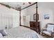 This bedroom features a four-poster bed, vaulted ceiling, and classic decor at 1137 Palm Cove Dr, Orlando, FL 32835