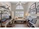 Bright and open home office with a large window, hardwood floors, and ample workspace at 1137 Palm Cove Dr, Orlando, FL 32835