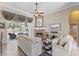 Inviting living room featuring a cozy stone fireplace, neutral tones, and sliding glass doors to the lanai at 1137 Palm Cove Dr, Orlando, FL 32835