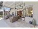 Covered patio featuring comfortable seating with striped cushions and a tile floor at 1137 Palm Cove Dr, Orlando, FL 32835