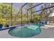 Screened-in pool area with a kidney-shaped pool, patio chairs, and privacy fence at 1137 Palm Cove Dr, Orlando, FL 32835