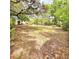 Beautiful backyard is an oasis with mature trees, providing a serene setting for outdoor activities and relaxation at 1212 Foxfire Dr, Apopka, FL 32712