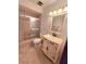 Traditional bathroom featuring tile floors, vanity, toilet, and tiled shower with glass door at 1212 Foxfire Dr, Apopka, FL 32712